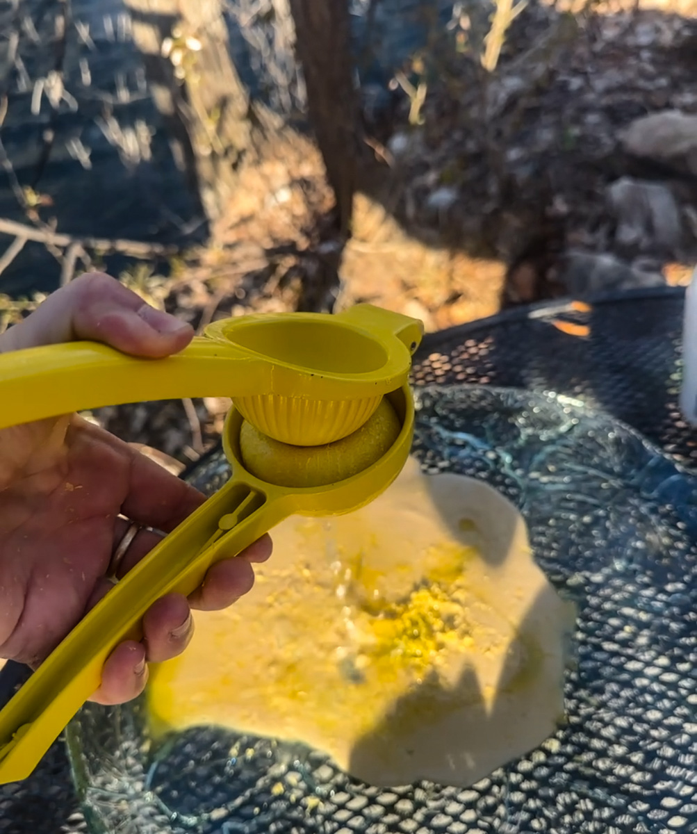 squeezing citrus into tahini.