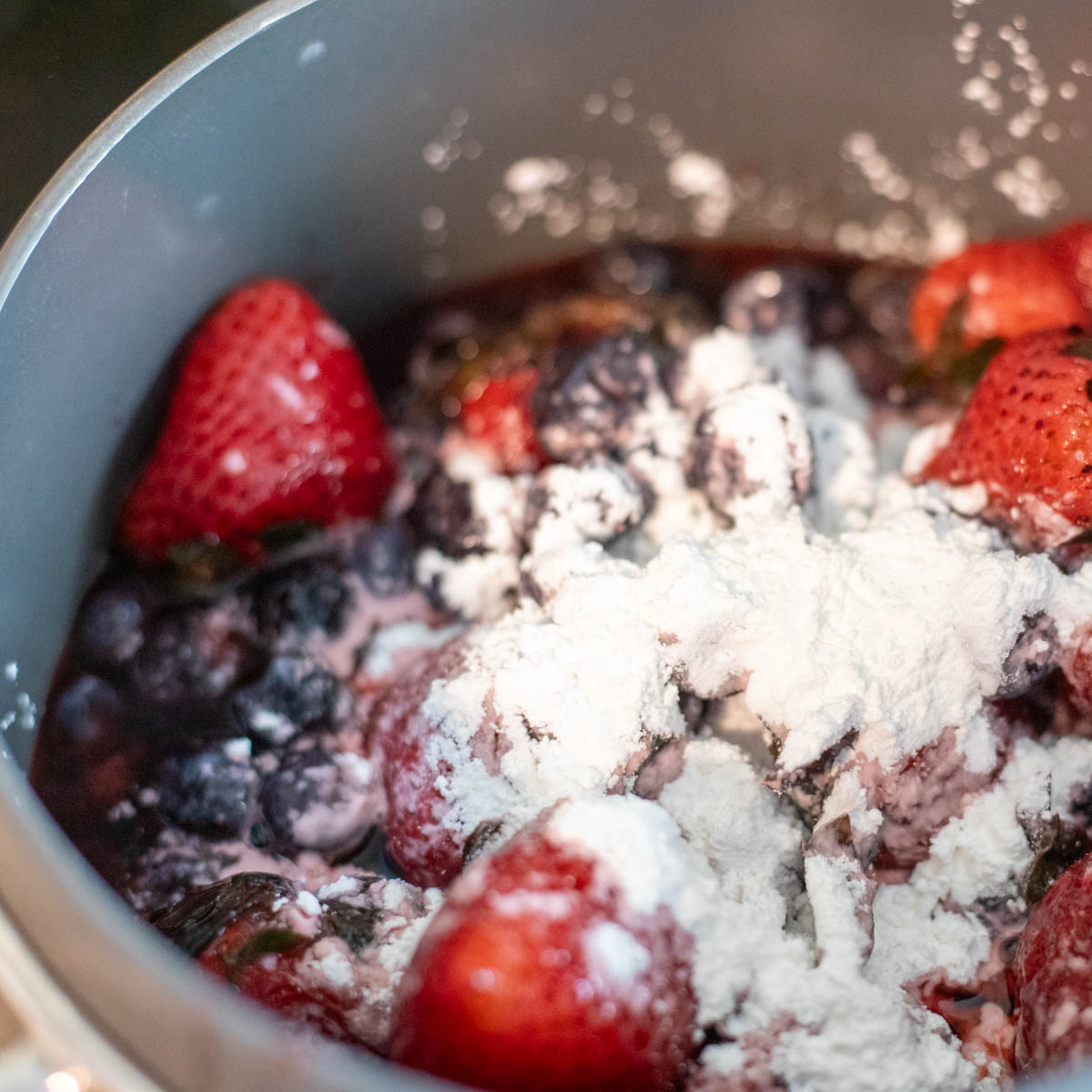 Frozen berries with corn starch about to be cooked.