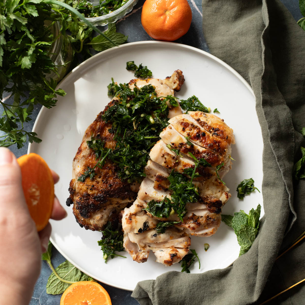 adding more citrus to the citrus chicken breast.